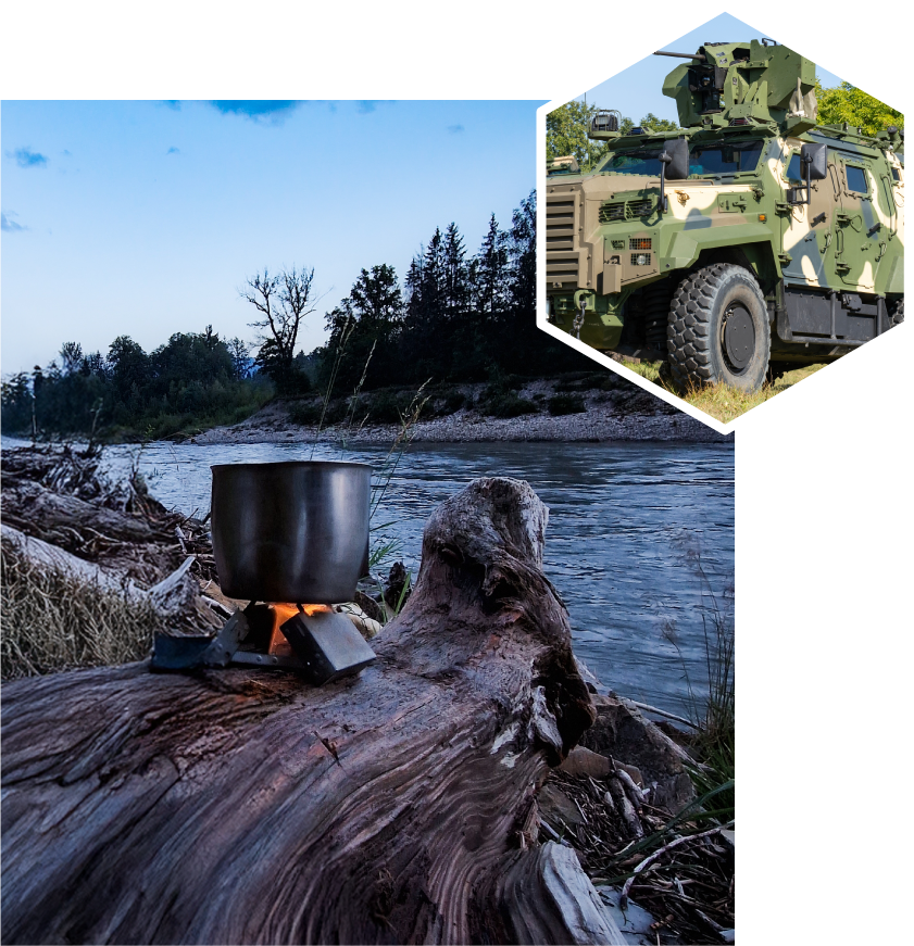 Camp stove on a log In the background, there is a body of water with a natural landscape. In the upper right corner, there is an inset image of a military vehicle with mounted equipment.